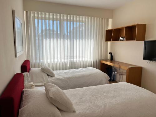 En eller flere senge i et værelse på Akmerkez Residence