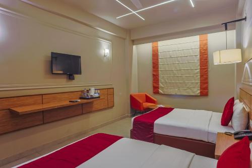 Letto o letti in una camera di Max Hotels Prayagraj