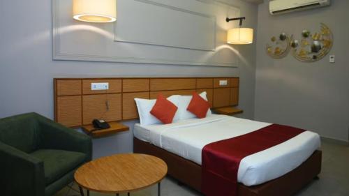 Letto o letti in una camera di Max Hotels Prayagraj
