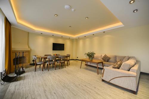 a living room with a couch and a table at SIA Resort and SPA in Tsaghkadzor