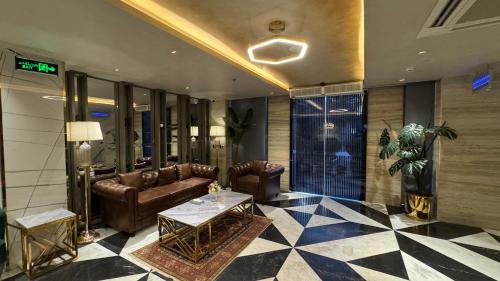 a lobby with couches and a table in a building at Taj Executive Hotel Islamabad - Luxury Stays Opposite Jinnah Super F-7 in Islamabad