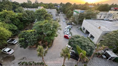 an aerial view of a parking lot with cars parked at Taj Executive Hotel Islamabad - Luxury Stays Opposite Jinnah Super F-7 in Islamabad