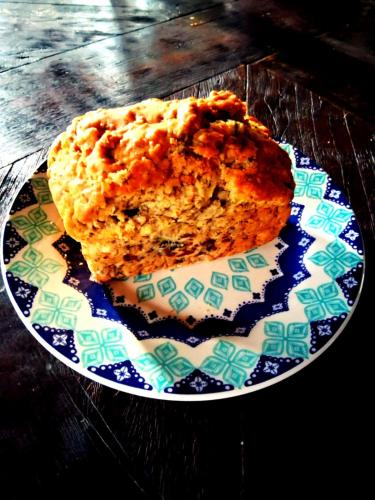 a piece of cake on a plate on a table at Cottage in Penedo! in Itatiaia