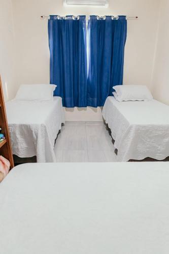 Ένα ή περισσότερα κρεβάτια σε δωμάτιο στο Pousada Áurea