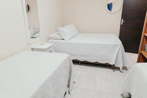 Ένα ή περισσότερα κρεβάτια σε δωμάτιο στο Pousada Áurea