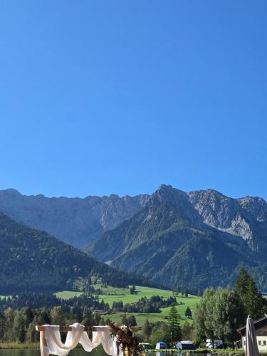 a view of a mountain range with a wedding marquee at Ferienwohnungen beim Silbergersee in Oberaudorf