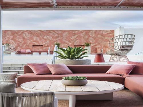 a living room with a couch and a table at Novotel Miami Brickell in Miami
