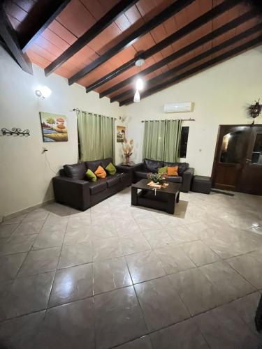 a large living room with couches and a table at Quinta LA PALOMA in San Lorenzo