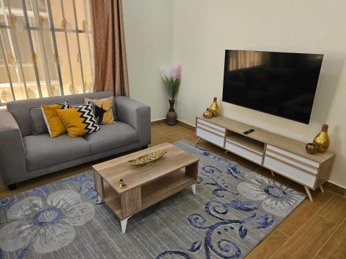 TV a/nebo společenská místnost v ubytování LG Homes Dodoma