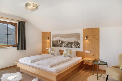 a bedroom with a bed in a room at Zillertalblick in Zell am Ziller