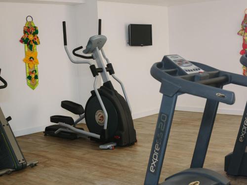 a gym with an exercise bike and a treadmill at ibis Styles Campina Grande in Campina Grande