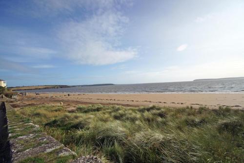 a beach with people on the sand and the water at 4 Bed in Duncannon oc-i553 in Ramsgrange