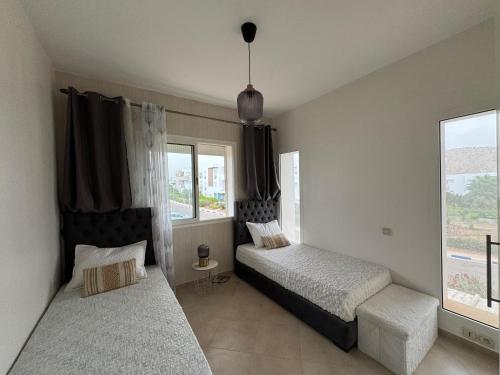 Ένα ή περισσότερα κρεβάτια σε δωμάτιο στο Lunja vibe