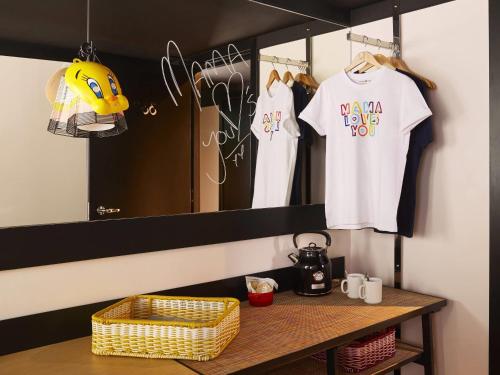 a dressing room with a table and a mirror at Mama Shelter London - Shoreditch in London