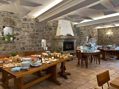 a kitchen with a table with food on it at Agriturismo PratoAlto in Onore