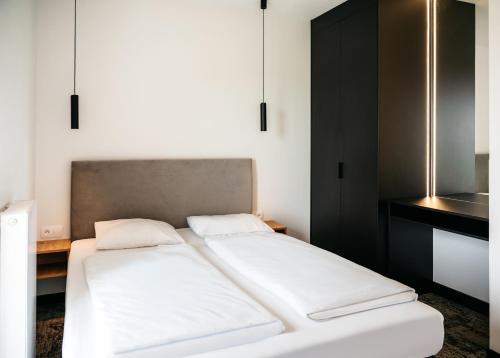Postel nebo postele na pokoji v ubytování Blu Apartments