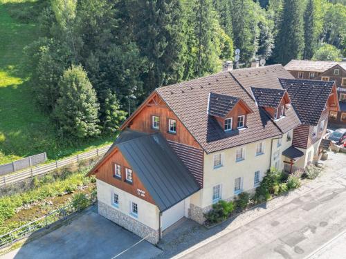 an overhead view of a house with solar panels on its roof at Apartmány Lékařský dům in Pec pod Sněžkou