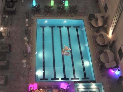 an overhead view of a pool in a building at Ibis Jeddah Malik Road in Jeddah