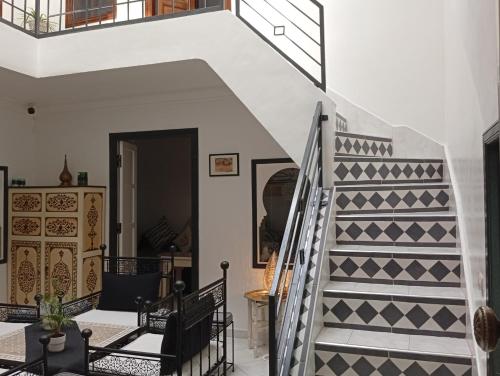 a staircase in a house with a geometric pattern at Ryad Ayad in Marrakech