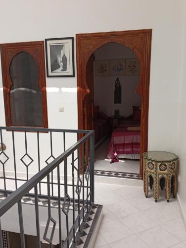 a room with a staircase and a bedroom at Ryad Ayad in Marrakech