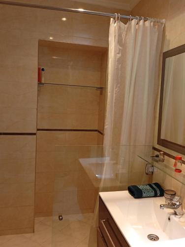 a bathroom with a shower and a sink at Ryad Ayad in Marrakech