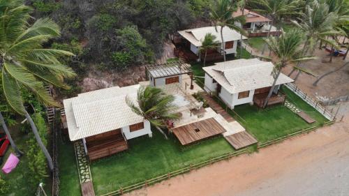 an aerial view of a house on the beach at Vila Picos Icapui in Icapuí