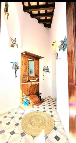a room with a bathroom with a sink and a floor at Casa Bakara Vejer old town in Vejer de la Frontera