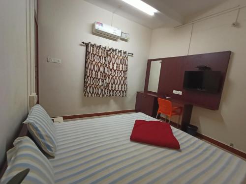 Cama o camas de una habitación en Aditya Residency