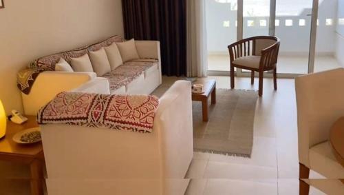 Giường trong phòng chung tại Penthouse terrace luxury sulla spiaggia