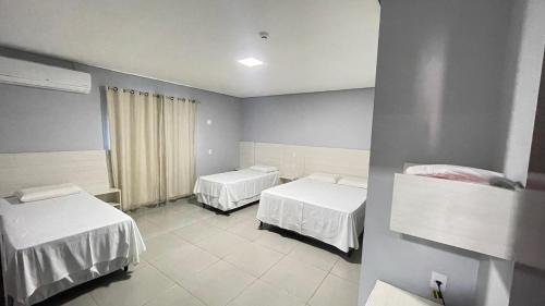 Postel nebo postele na pokoji v ubytování HOTEL VIZON II