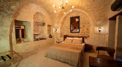 Ένα ή περισσότερα κρεβάτια σε δωμάτιο στο Hotel Estara