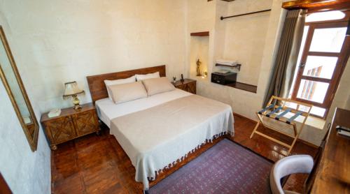 Ένα ή περισσότερα κρεβάτια σε δωμάτιο στο Hotel Estara
