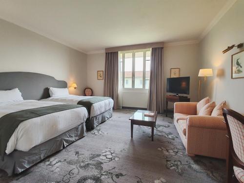 Un ou plusieurs lits dans un hébergement de l'établissement Relais de Margaux - Hôtel, Golf & Spa