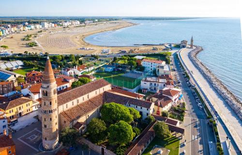an aerial view of a town next to the ocean at Bright villa in Caorle with private garden in Caorle