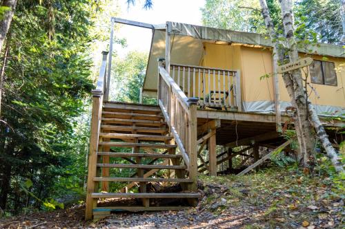 a staircase leading up to a tree house at Dominion Hill Country Inn in Bocabec