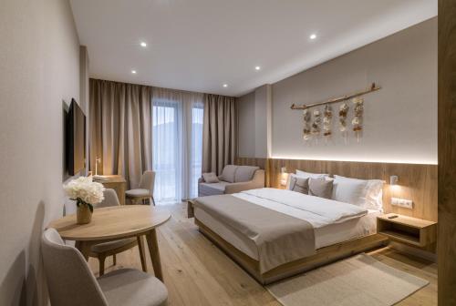 a hotel room with a bed and a table at RIKKA KHUST thermal resort in Khust