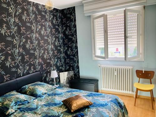 Ένα ή περισσότερα κρεβάτια σε δωμάτιο στο Appartement "vintage 70", 2 pièces, 45 m2