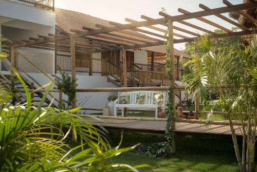 a wooden deck in the backyard of a house at Pousada Villa Tibá in Jericoacoara