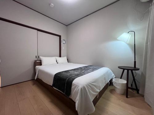 Ένα ή περισσότερα κρεβάτια σε δωμάτιο στο 遇見民宿