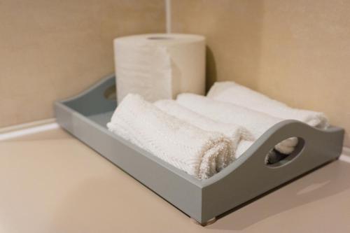 a towel rack with towels in a bathroom at Manchester Waterside Retreat in Manchester