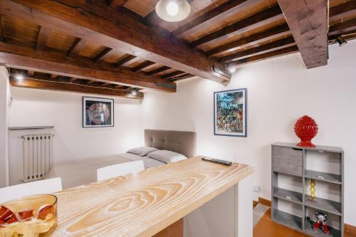 Postel nebo postele na pokoji v ubytování Tour d'Art - Piazza Grande Arezzo