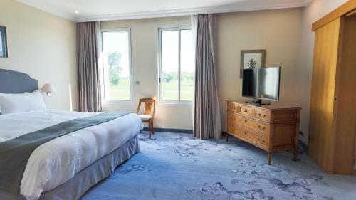 Un ou plusieurs lits dans un hébergement de l'établissement Relais de Margaux - Hôtel, Golf & Spa