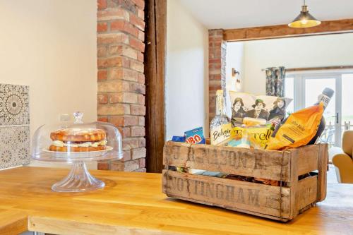 a table with a box of food on top of it at Monks Barn in Upwell