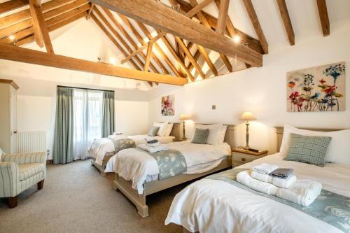 Voodi või voodid majutusasutuse Platford Barn toas