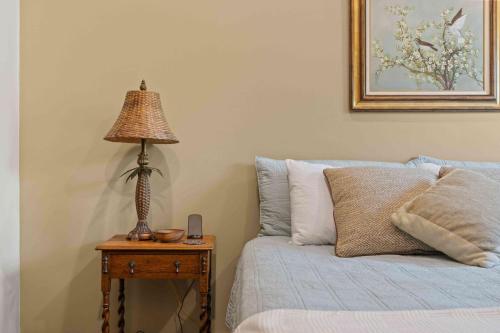 a lamp sitting on a table next to a bed at Main Street Elevated in Highlands