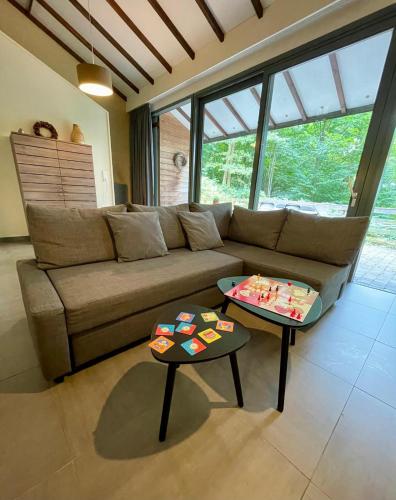 a living room with a couch and two tables at Le Vieux Sart 6 Coo - Stavelot in Stavelot
