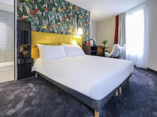 ibis Styles Puteaux Paris La Defenseにあるベッド