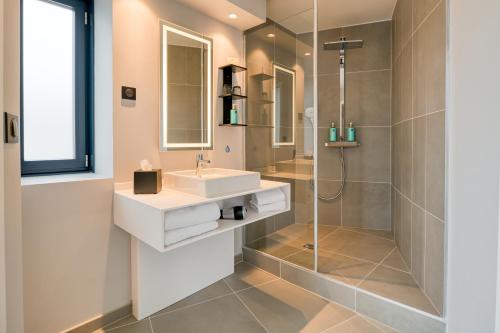 a bathroom with a sink and a shower at Novotel Paris Centre Bercy in Paris