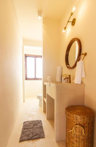 a bathroom with a sink and a mirror at Ocean Views Amazing Rooftop in Mazunte