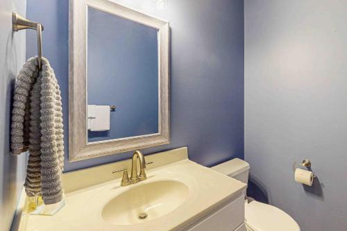 a bathroom with a sink and a mirror and a toilet at Ocean Mist --- 10 Ocean Mist Dr in Ocean View